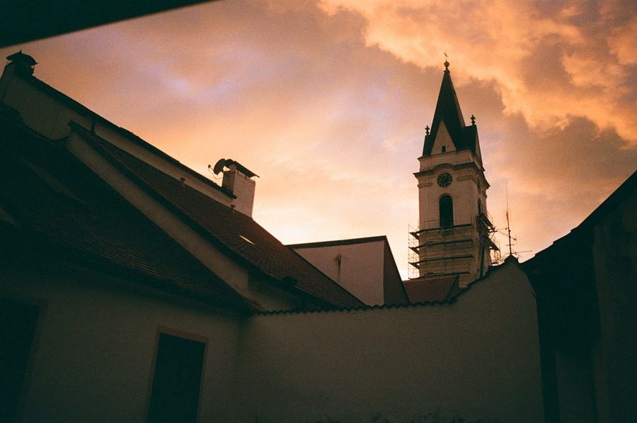 Church tower against an orange evening sky