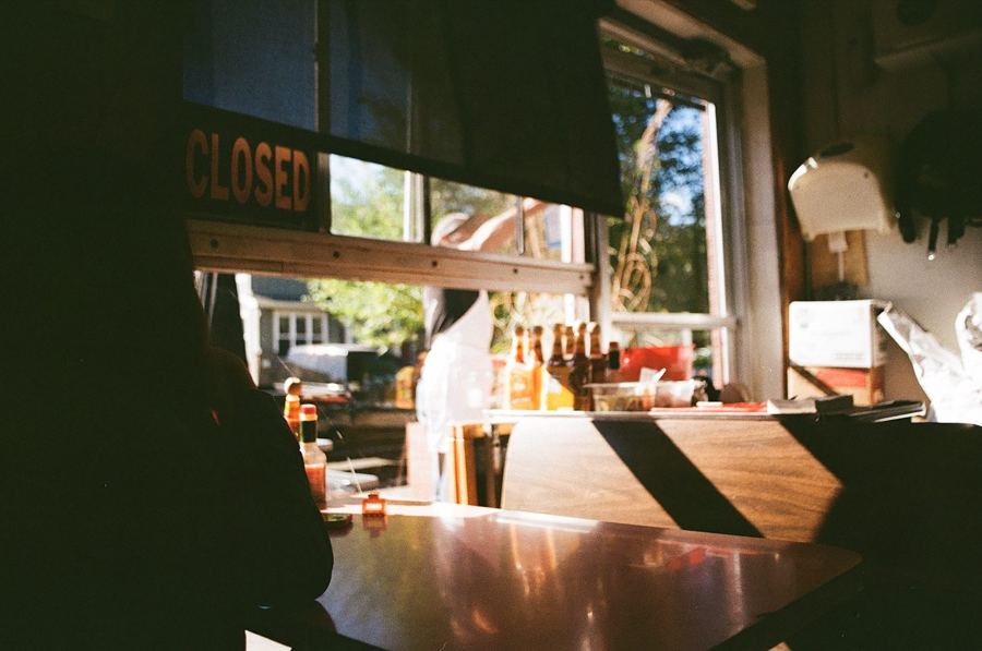 Inside a closed diner, afternoon light