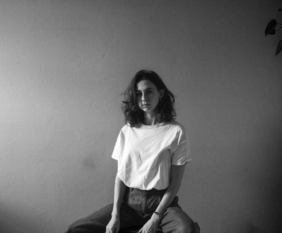 Black and white studio portrait in a white T-shirt